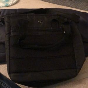 Black Gaiam Yoga bag w/detachable shoulder strap, handles, and lots of pockets.